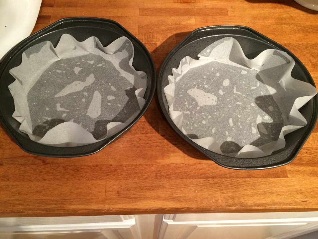 line to cake tins with parchment paper and grease with Pam